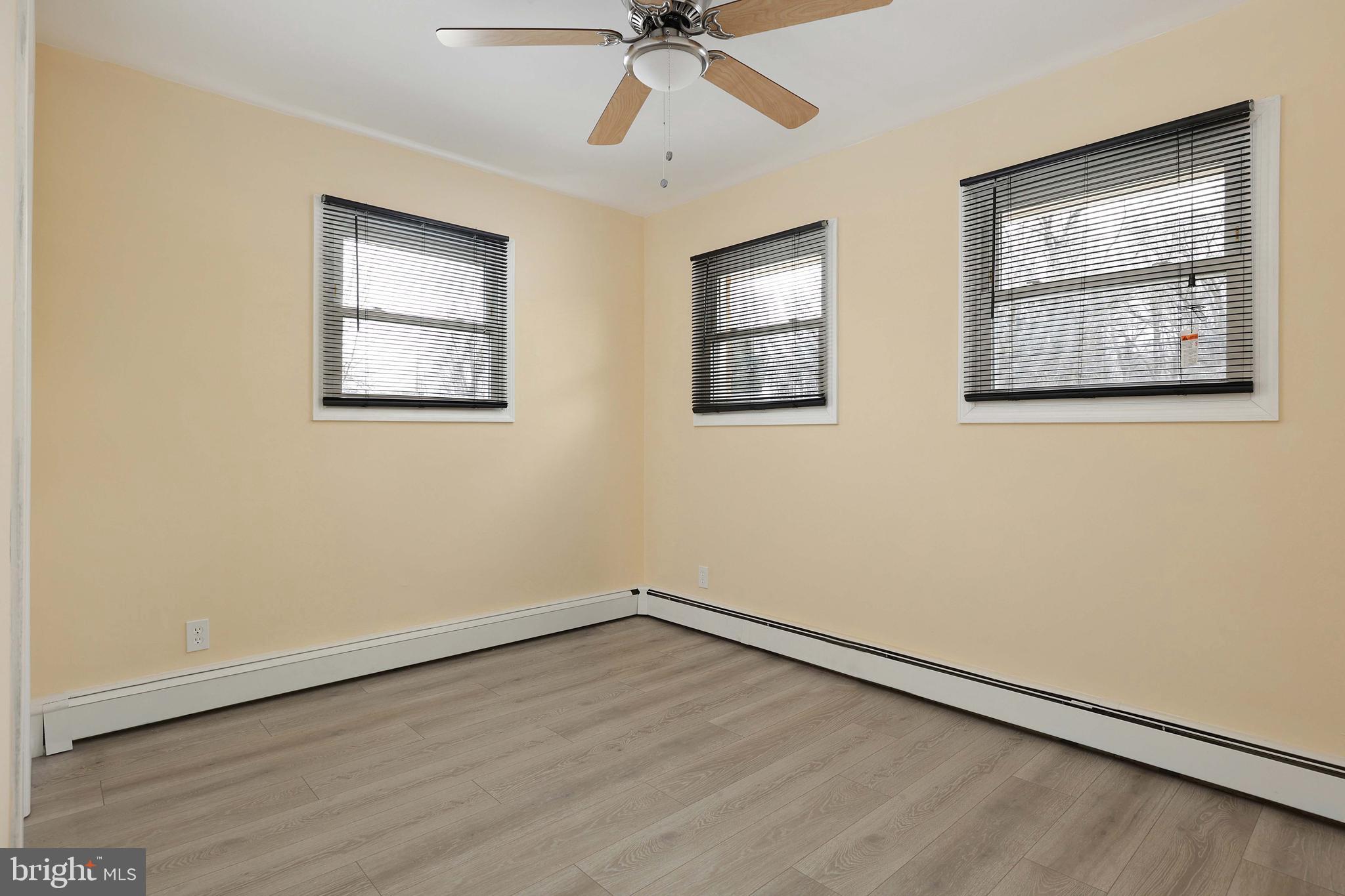 105 Kentucky Avenue Hamilton, NJ 08619 - Photo 15 of 29 wooden floor in an empty room with a window