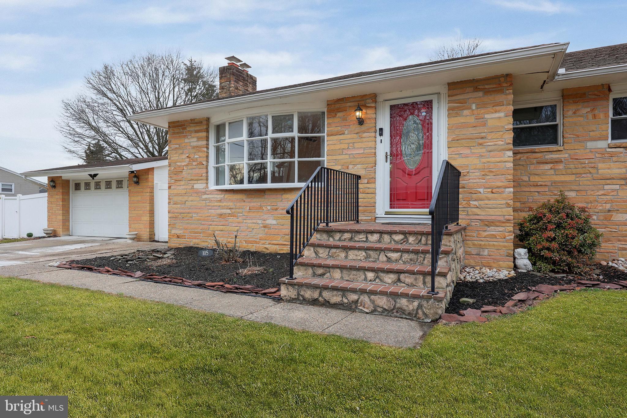 105 Kentucky Avenue Hamilton, NJ 08619 - Photo 4 of 29 a front view of a house with a garden