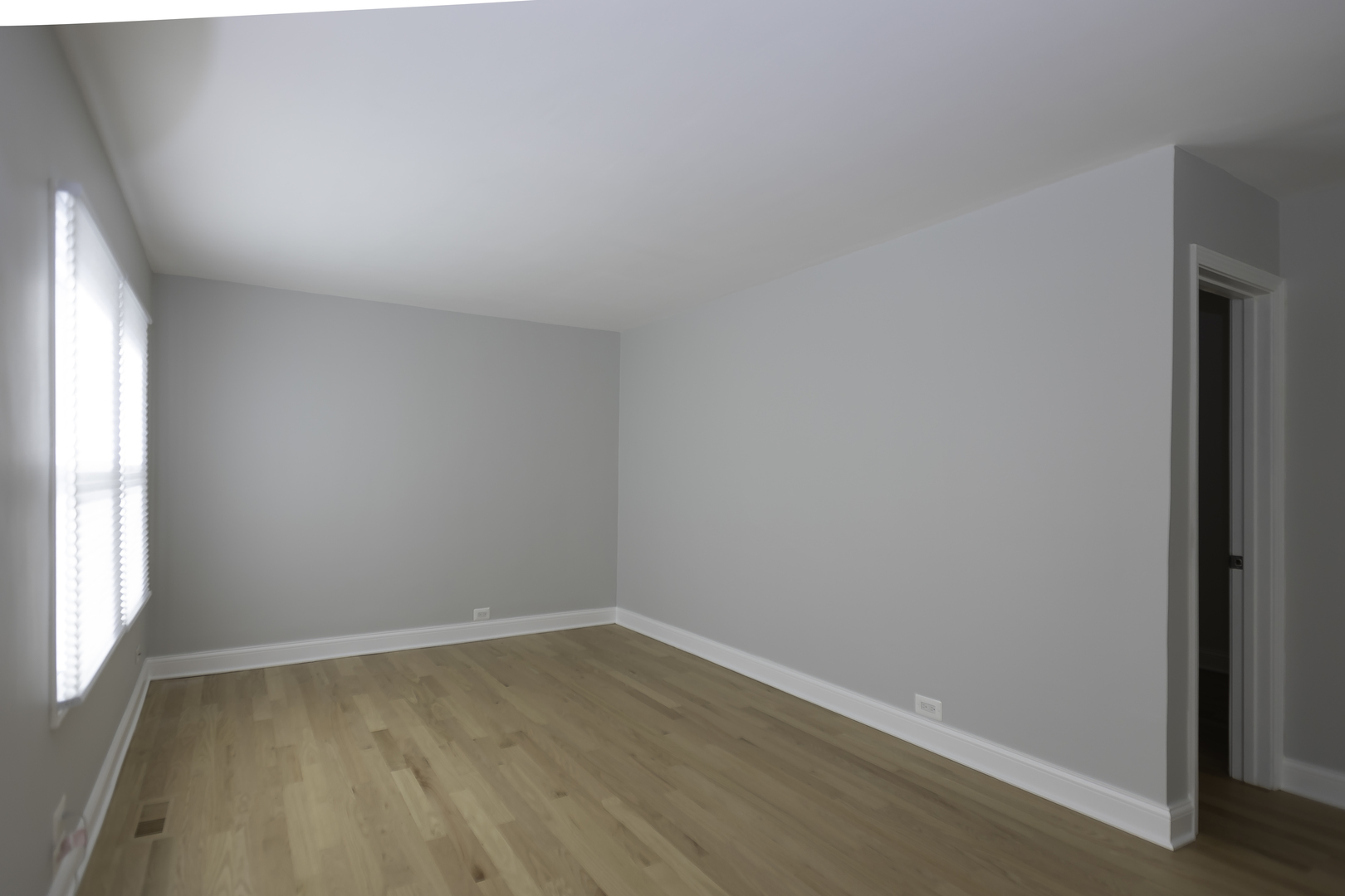 3948 North Olcott Avenue, Unit 1 Chicago, IL 60634 - Photo 4 of 8 an empty room with a window