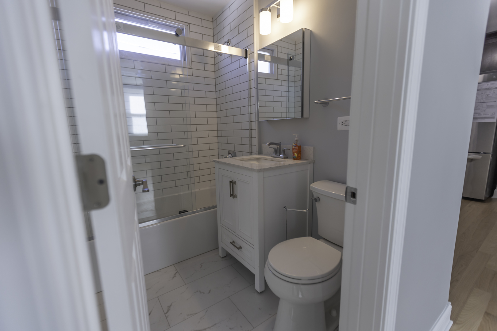3948 North Olcott Avenue, Unit 1 Chicago, IL 60634 - Photo 8 of 8 a bathroom with a toilet and a sink