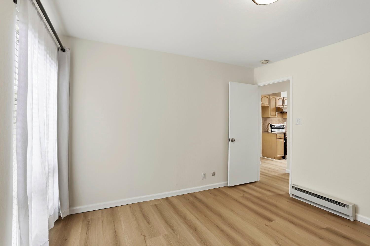 9005 Alcosta Boulevard, Unit 215 San Ramon, CA 94583 - Photo 14 of 30 a view of an empty room and wooden floor