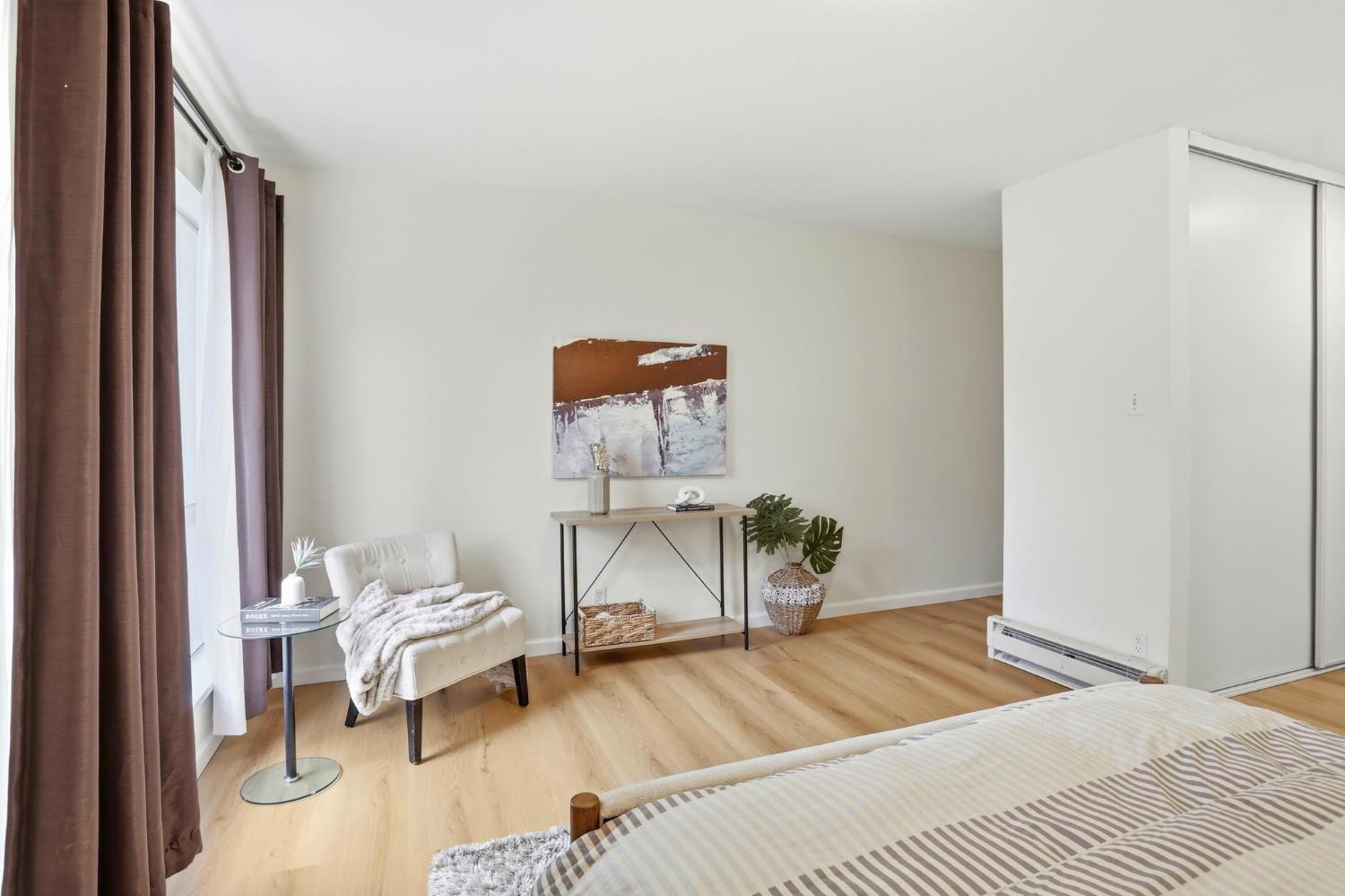 9005 Alcosta Boulevard, Unit 215 San Ramon, CA 94583 - Photo 17 of 30 a room with a bed and a lamp on table