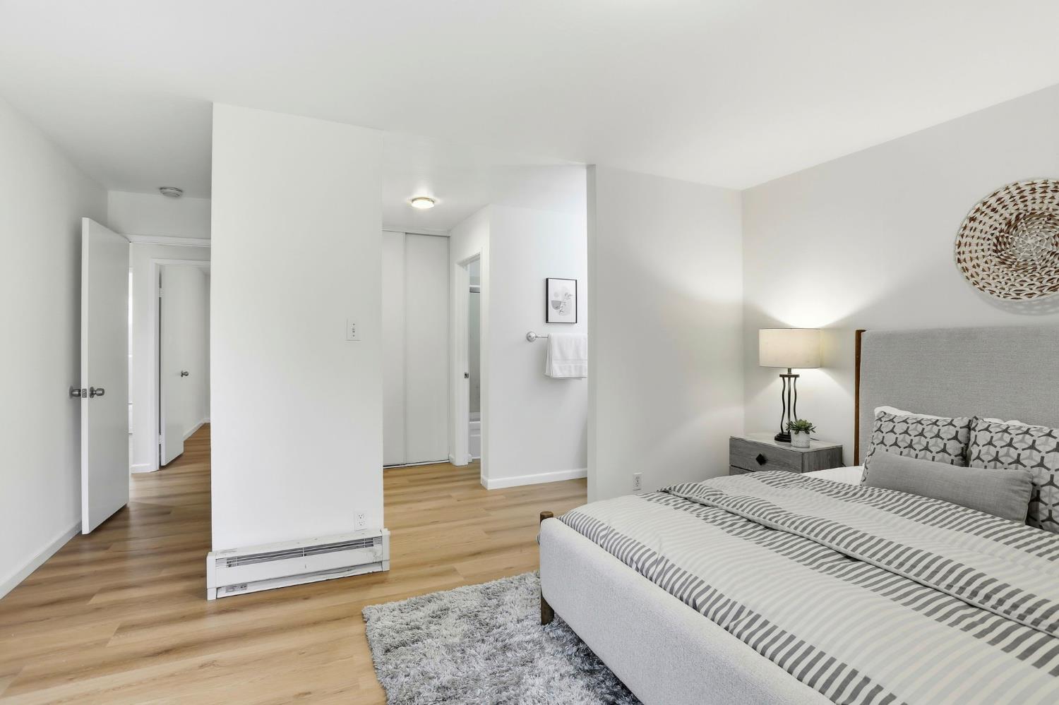 9005 Alcosta Boulevard, Unit 215 San Ramon, CA 94583 - Photo 19 of 30 a bedroom with a bed and wooden floor