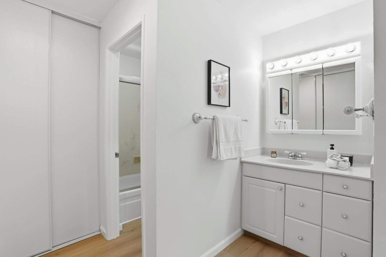 9005 Alcosta Boulevard, Unit 215 San Ramon, CA 94583 - Photo 20 of 30 a bathroom with a double vanity sink and mirror