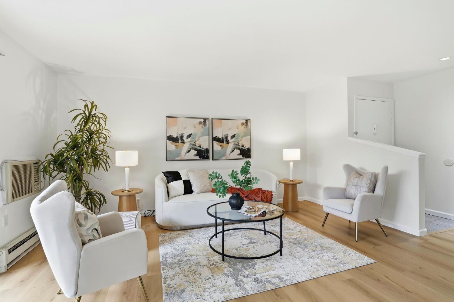 9005 Alcosta Boulevard, Unit 215 San Ramon, CA 94583 - Photo 2 of 30 a living room with furniture and a potted plant