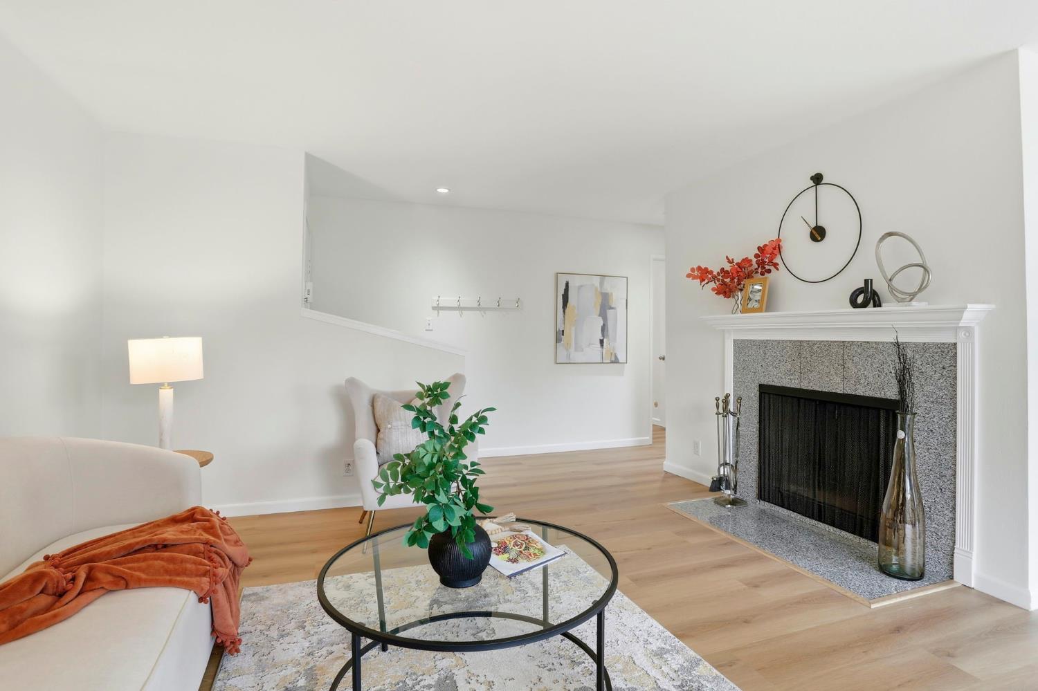 9005 Alcosta Boulevard, Unit 215 San Ramon, CA 94583 - Photo 6 of 30 a living room with furniture and a fireplace