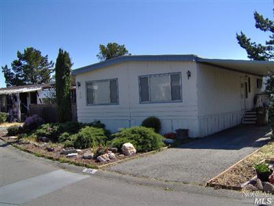98 Yosemite Road, Unit 98 YO San Rafael, CA 94903 - Photo 1 of 2 a front view of a house with a yard
