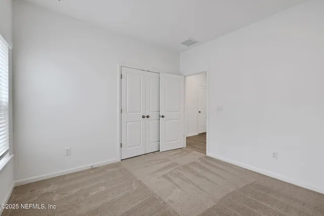 a view of a city with lots of residential buildings lake and ocean view