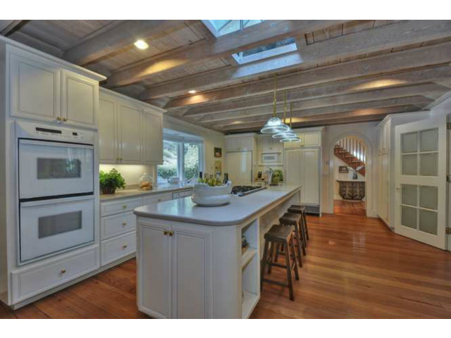 15670 Peach Hill Road Saratoga, CA 95070 - Photo 12 of 25 a kitchen with cabinets and wooden floor
