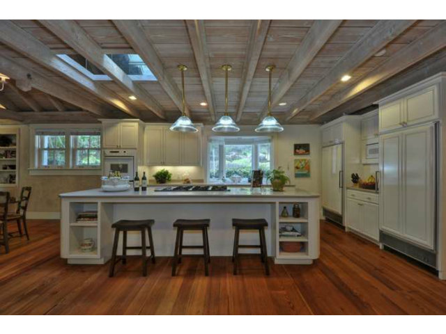15670 Peach Hill Road Saratoga, CA 95070 - Photo 13 of 25 a open kitchen with stainless steel appliances granite countertop a wooden table chairs and chandelier