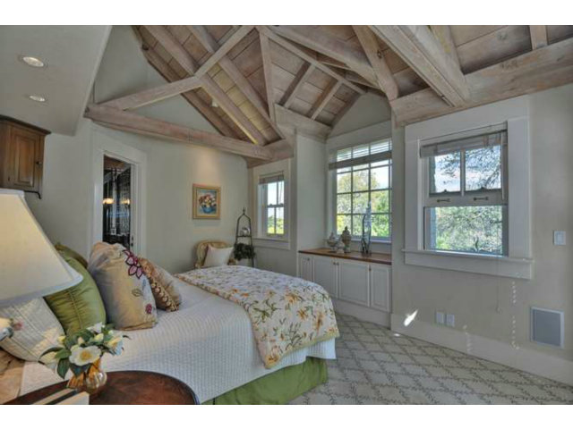 15670 Peach Hill Road Saratoga, CA 95070 - Photo 19 of 25 a bedroom with a bed mirror and window