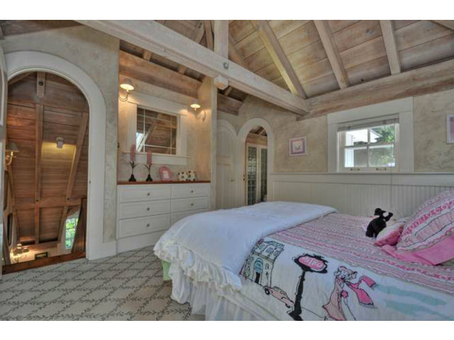 15670 Peach Hill Road Saratoga, CA 95070 - Photo 20 of 25 a bedroom with a bed a mirror and dresser