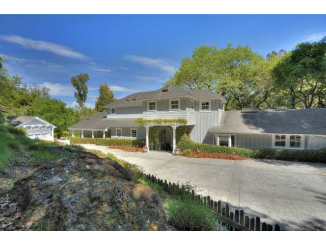 15670 Peach Hill Road Saratoga, CA 95070 - Photo 4 of 25 a view of a big house with a yard