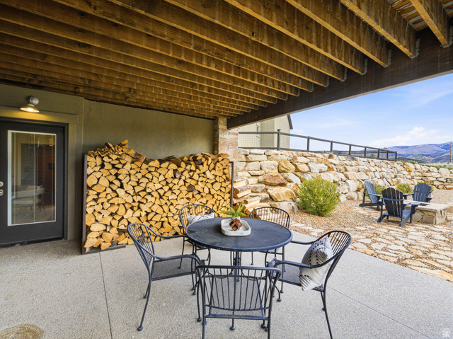 402 Shadow Hill Road Wanship, UT 84017 - Photo 69 of 90 View of patio with outdoor dining area and a mountain view
