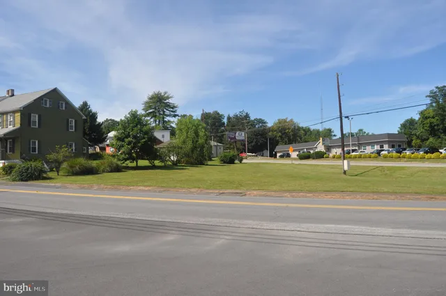 a view of a building with a yard