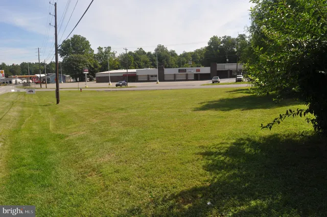 a view of a swimming pool with a yard