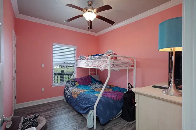 a bed room with a bed and a chandelier