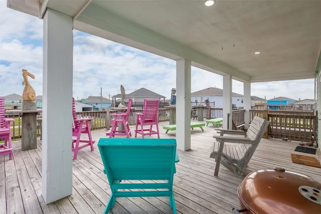 a living room with fireplace furniture and a large window