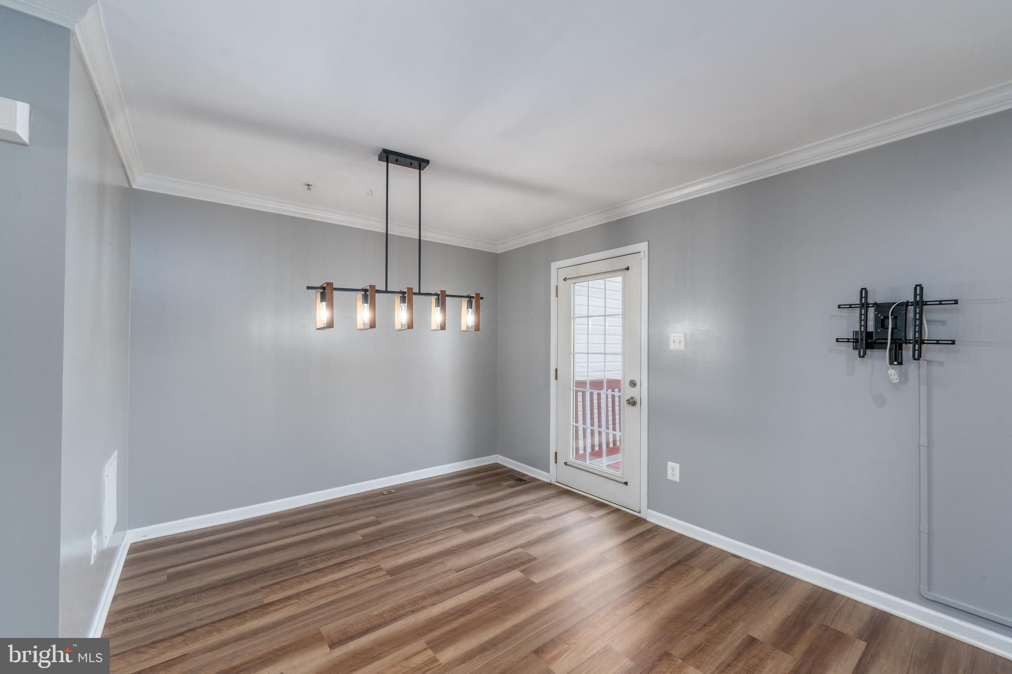 9903 Decatur Road Baltimore, MD 21220 - Photo 18 of 37 a view of a room with wooden floor and window