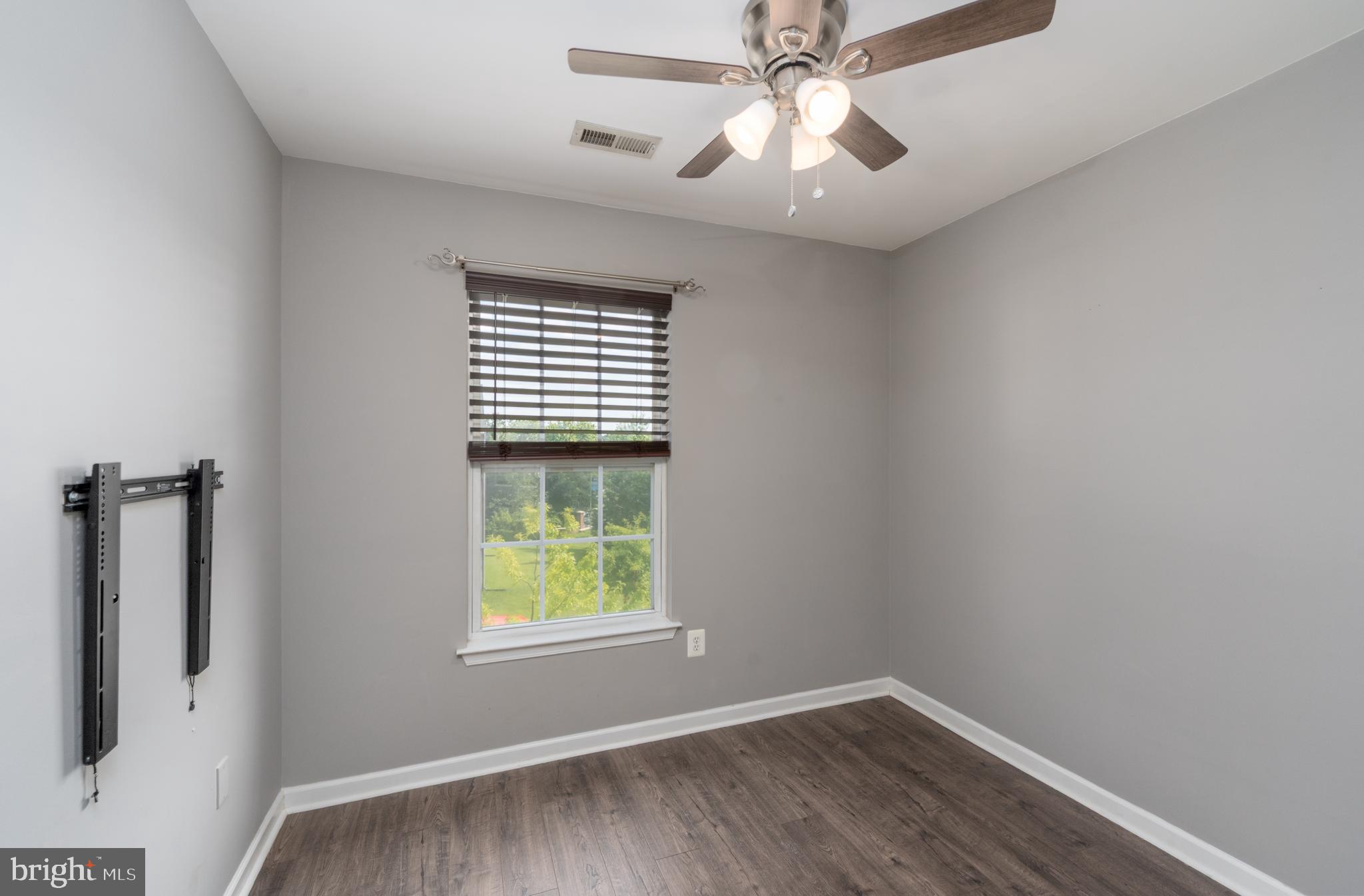 9903 Decatur Road Baltimore, MD 21220 - Photo 24 of 37 an empty room with windows and fan