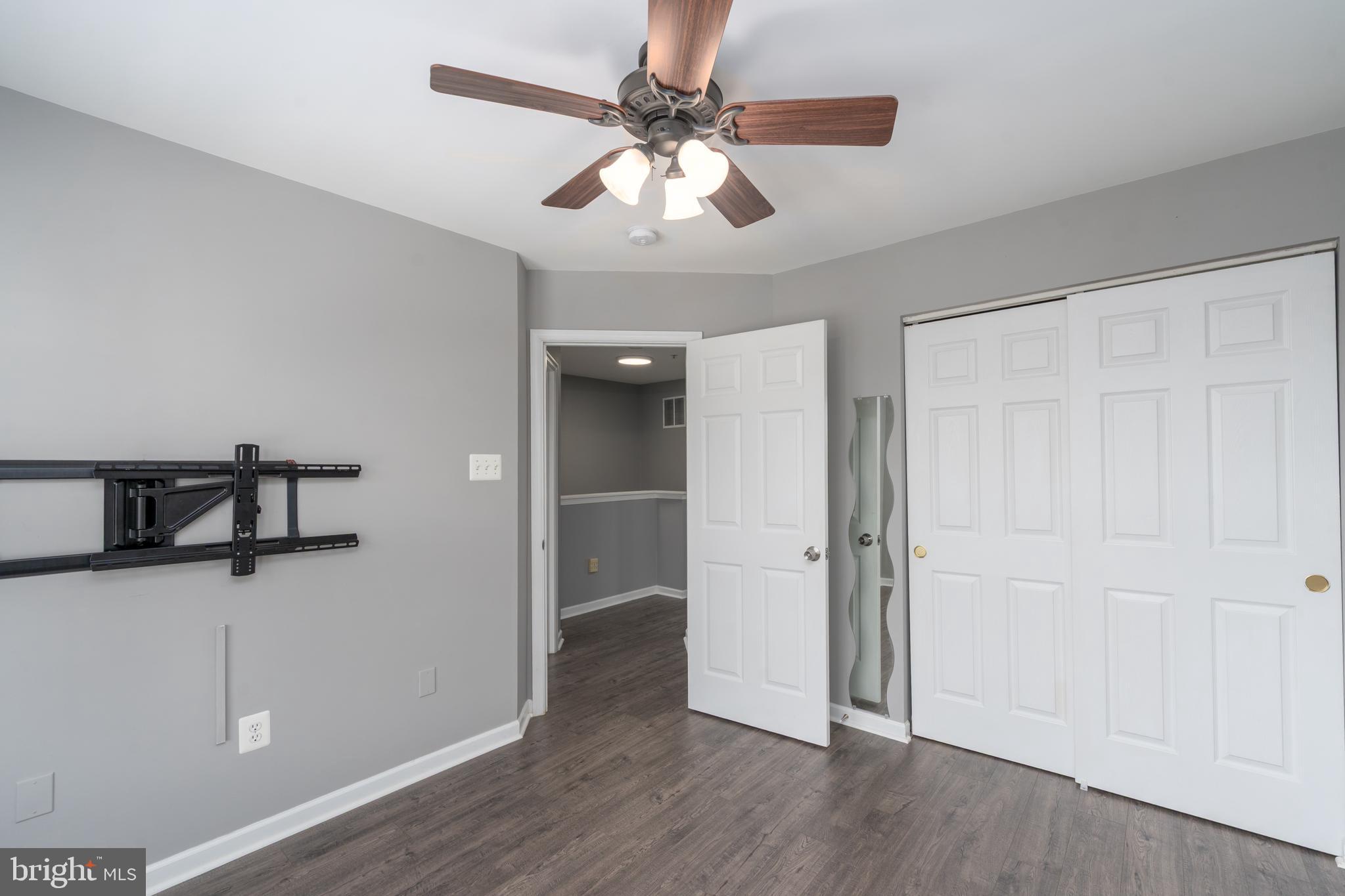 9903 Decatur Road Baltimore, MD 21220 - Photo 26 of 37 wooden floor in an empty room with a window