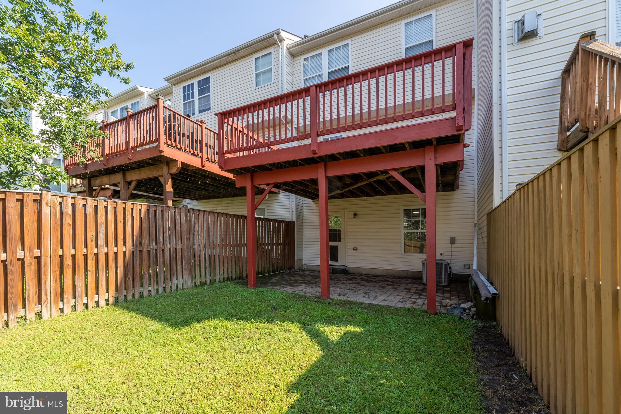 9903 Decatur Road Baltimore, MD 21220 - Photo 36 of 37 a view of a house with wooden deck and furniture