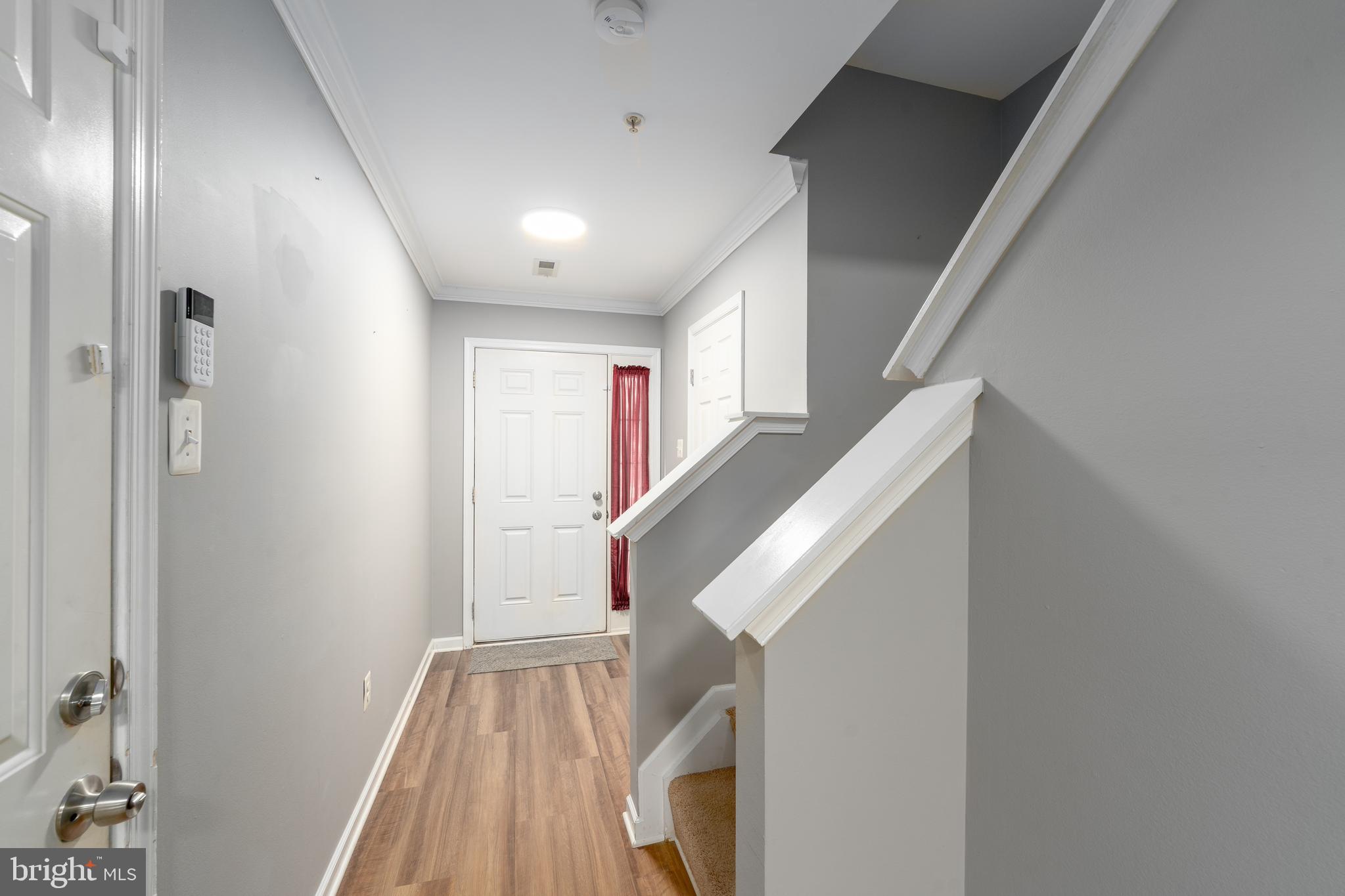 9903 Decatur Road Baltimore, MD 21220 - Photo 5 of 37 a view of entryway with wooden floor