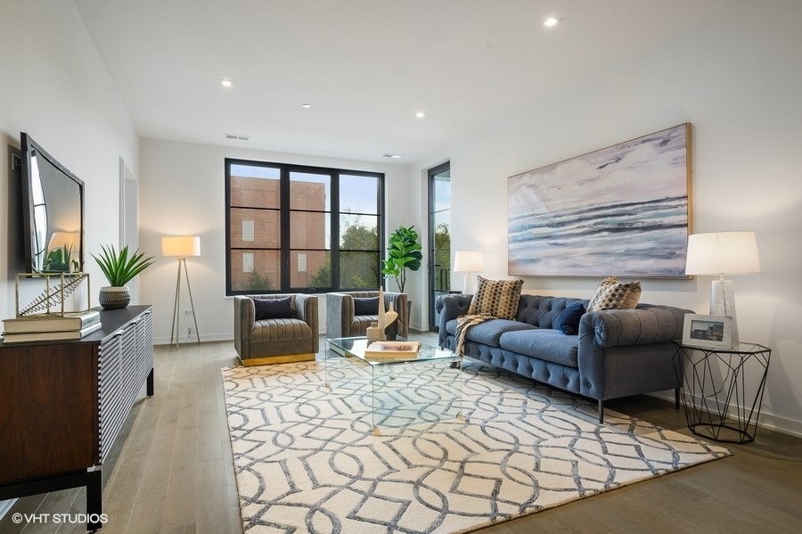 1400 West Monroe Street, Unit 5F Chicago, IL 60607 - Photo 12 of 25 a living room with furniture a flat screen tv and a large window