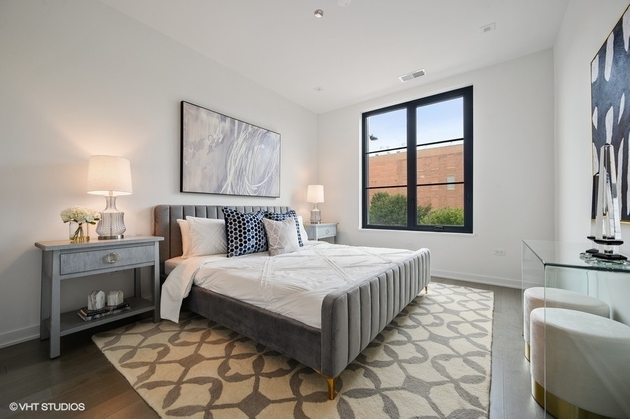 1400 West Monroe Street, Unit 5F Chicago, IL 60607 - Photo 14 of 25 a bedroom with a bed and a window