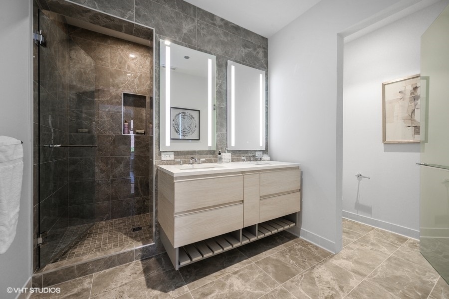 1400 West Monroe Street, Unit 5F Chicago, IL 60607 - Photo 16 of 25 a bathroom with a shower sink and mirror