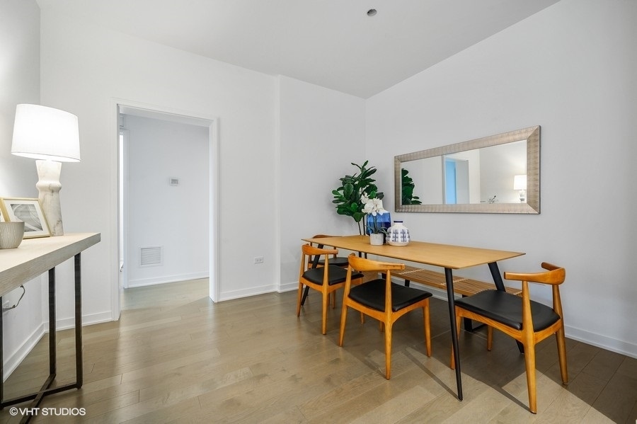 1400 West Monroe Street, Unit 5F Chicago, IL 60607 - Photo 9 of 25 a dining room with furniture and window
