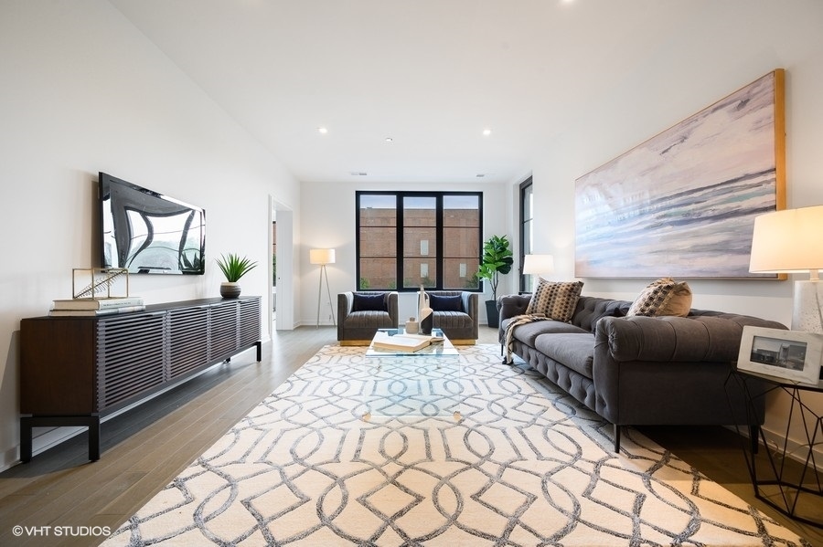 1400 West Monroe Street, Unit 5F Chicago, IL 60607 - Photo 10 of 25 a bedroom with furniture and a window