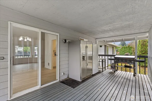 a view of a balcony with wooden floor