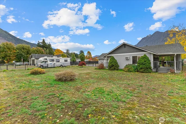 a view of house with outdoor space and garden