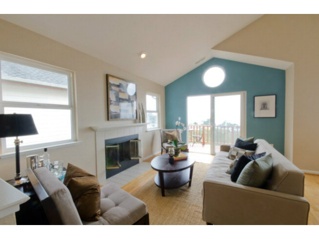 538 Monterey Road, Unit B Pacifica, CA 94044 - Photo 3 of 25 a living room with furniture and a fireplace