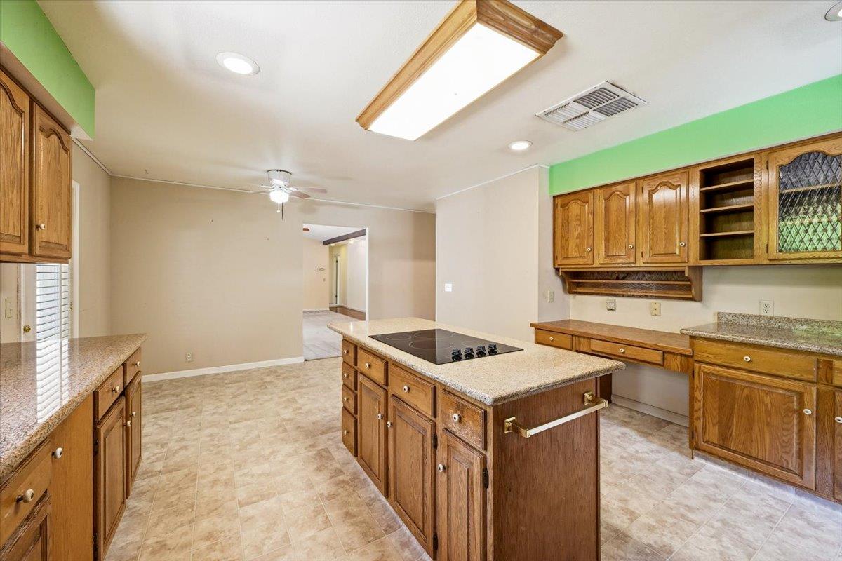 12600 Friar Tuck Road Grass Valley, CA 95949 - Photo 25 of 56 a kitchen that has a sink and a stove in it