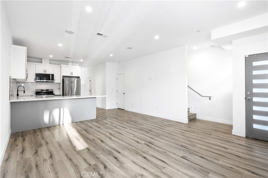 5000 Cleon Avenue, Unit 1/2 North Hollywood, CA 91601 - Photo 4 of 36 a view of kitchen view with wooden floor and window