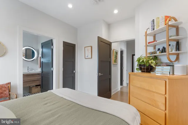 a bedroom with a bed and a dresser