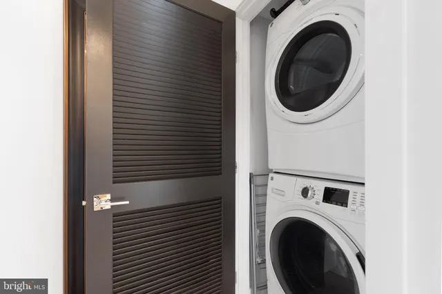 a view of a hallway with washer and dryer