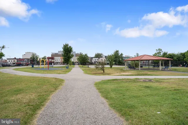 a view of a swimming pool and a yard