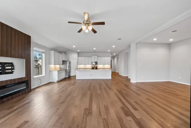 a view of a kitchen with a sink and a microwave