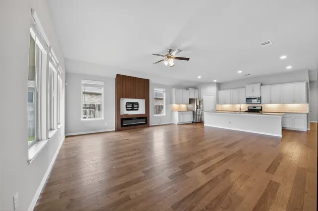 a view of kitchen with furniture and wooden floor