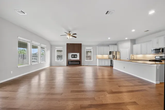 a view of kitchen with furniture and wooden floor