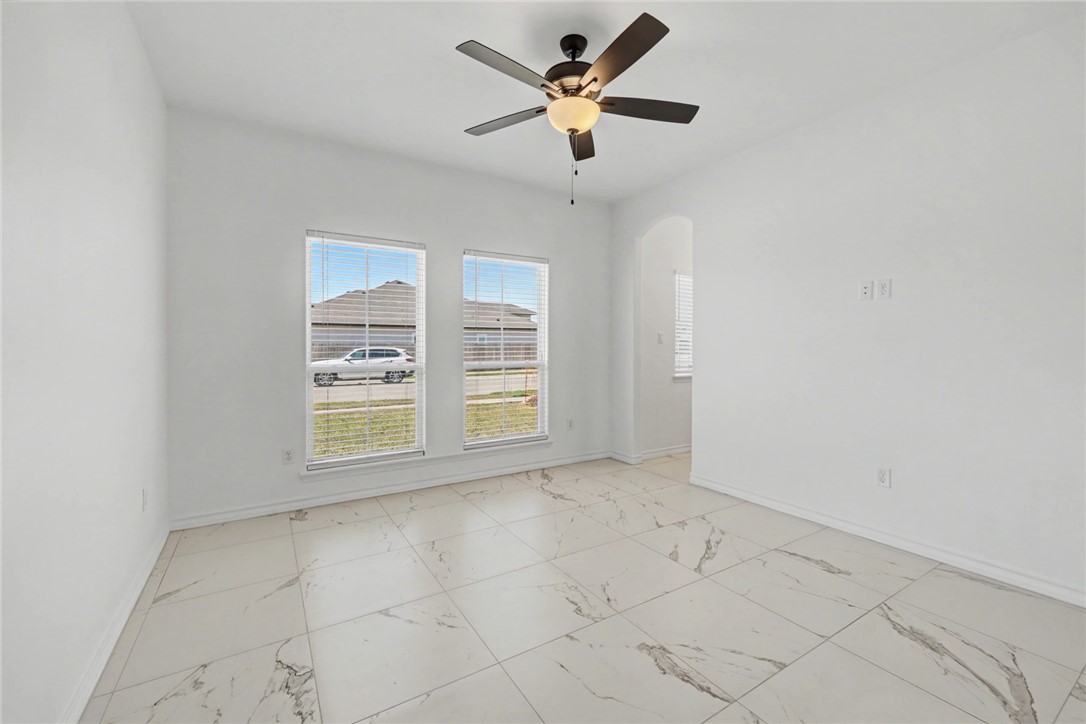 118 Amethyst Street Portland, TX 78374 - Photo 18 of 39 an empty room with windows and fan