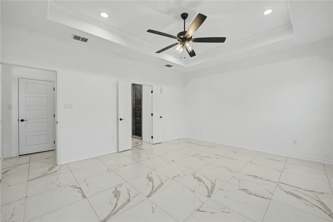 118 Amethyst Street Portland, TX 78374 - Photo 23 of 39 an empty room with fan and windows