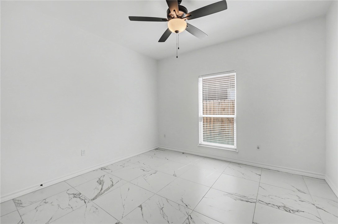 118 Amethyst Street Portland, TX 78374 - Photo 28 of 39 an empty room with windows and fan