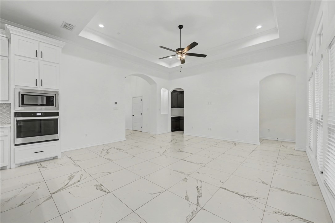 118 Amethyst Street Portland, TX 78374 - Photo 5 of 39 a view of an empty room with a kitchen