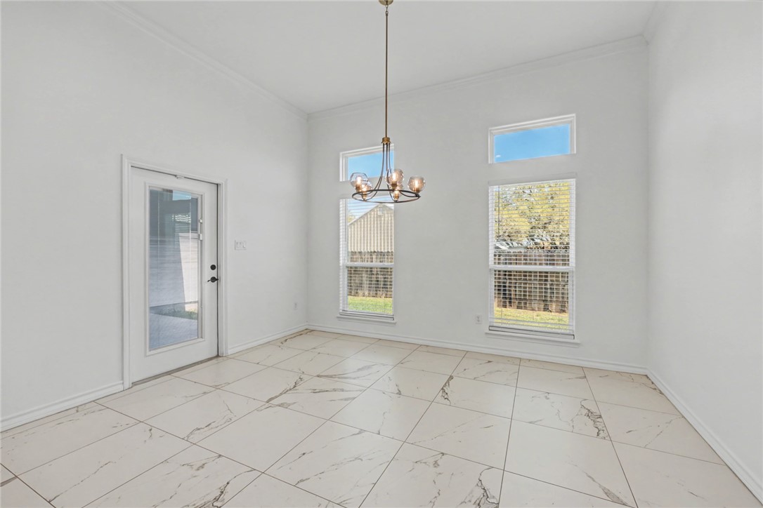 118 Amethyst Street Portland, TX 78374 - Photo 10 of 39 a view of an empty room with a window