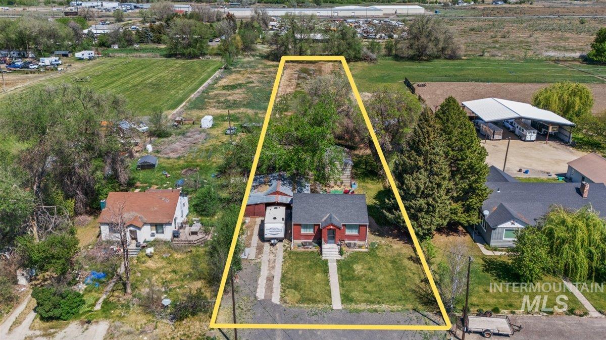 1958 East 1775 South Gooding, ID 83330 - Photo 1 of 49 Aerial perspective showcasing a parcel with established trees and a residential structure