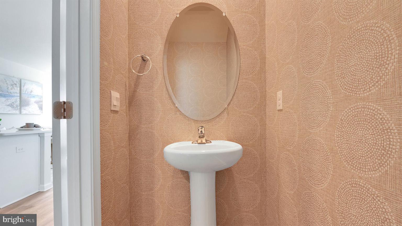 4 Whaler Drive Runnemede, NJ 08078 - Photo 15 of 24 a bathroom with a sink a mirror and a shower